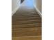 Stairway with modern wood-look flooring leads to the upper level of the home at 1309 Heritage Commons Dr, Winter Springs, FL 32708