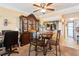 Dining area with elegant china cabinet, table with chairs and ceiling fan at 145 N Halifax Ave # 211, Daytona Beach, FL 32118