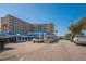 Harbor View condo complex with covered parking, lush landscaping and many parking spaces at 145 N Halifax Ave # 211, Daytona Beach, FL 32118