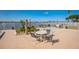 Community pool deck with seating area, spa and shower at 145 N Halifax Ave # 211, Daytona Beach, FL 32118