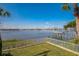 Stunning view of the wide open bay, featuring a dock and green space at 145 N Halifax Ave # 211, Daytona Beach, FL 32118
