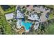 Aerial view of community amenities, including the pool, sand volleyball court and ' playground at 1620 Pelican Dr, Davenport, FL 33896