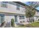 Cozy backyard patio with seating, lush grass, and charming exterior design at 1620 Pelican Dr, Davenport, FL 33896