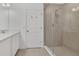 Modern bathroom showcases a glass-enclosed shower and a white vanity with storage at 1620 Pelican Dr, Davenport, FL 33896