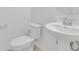 Bathroom featuring a pedestal sink and a standard toilet at 1620 Pelican Dr, Davenport, FL 33896