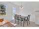 Dining area with window, pendant lighting, and contemporary table set at 1620 Pelican Dr, Davenport, FL 33896
