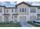 Charming two-story townhome features a one car garage and inviting front entrance at 1620 Pelican Dr, Davenport, FL 33896