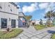 Commercial building with well-maintained landscaping, an outdoor patio, and a quaint walkway at 1620 Pelican Dr, Davenport, FL 33896