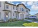 Charming two-story townhome features a one car garage and landscaped front yard at 1620 Pelican Dr, Davenport, FL 33896