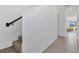 Hallway and stairway feature tiled floors and a light-filled entryway at 1620 Pelican Dr, Davenport, FL 33896
