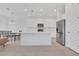 Bright open kitchen with stainless steel appliances, island, and white cabinetry at 1620 Pelican Dr, Davenport, FL 33896