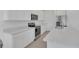 Updated kitchen featuring white cabinetry, stainless steel appliances, and stone countertops at 1620 Pelican Dr, Davenport, FL 33896