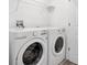 A practical laundry room equipped with a washer and dryer for everyday convenience at 1620 Pelican Dr, Davenport, FL 33896