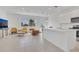 Bright open-concept living room and kitchen boasts tiled flooring at 1620 Pelican Dr, Davenport, FL 33896