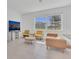 Bright living room features a large window and comfortable seating at 1620 Pelican Dr, Davenport, FL 33896