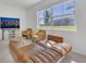 Comfortable living room features a large window and modern decor at 1620 Pelican Dr, Davenport, FL 33896