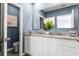 Well-lit bathroom featuring a double vanity, granite countertop, and a fresh, modern design at 1815 Waggoner St, Kissimmee, FL 34744