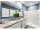 Stylish bathroom with double sinks, granite counters, shower, and neutral tones for a soothing experience at 1815 Waggoner St, Kissimmee, FL 34744