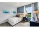 Comfortable bedroom with a twin bed, artwork, and a window offering a pleasant view at 1815 Waggoner St, Kissimmee, FL 34744