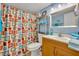 Bathroom featuring a vanity, toilet, and shower with a colorful curtain at 185 Scottsdale Sq # 185, Winter Park, FL 32792