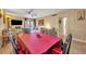 Dining area with a large table and chairs, open to the living room at 185 Scottsdale Sq # 185, Winter Park, FL 32792