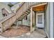 Exterior entrance featuring stairs, light green siding and a white door at 185 Scottsdale Sq # 185, Winter Park, FL 32792