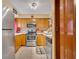 A cozy kitchen with oak cabinets and stainless steel appliances at 185 Scottsdale Sq # 185, Winter Park, FL 32792