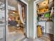 View from patio through sliding glass doors to a spacious living room with a view of the kitchen at 185 Scottsdale Sq # 185, Winter Park, FL 32792
