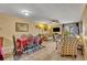 Cozy living room with tile floors, a dining table and comfortable seating at 185 Scottsdale Sq # 185, Winter Park, FL 32792