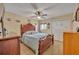 Inviting main bedroom with decorative headboard and ceiling fan at 185 Scottsdale Sq # 185, Winter Park, FL 32792