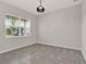 Neutral living room with a window and tile flooring at 2050 Brillante Dr, St Cloud, FL 34771