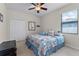 Bedroom showcasing a ceiling fan, window with blinds, and neutral carpet at 2829 Autumn Breeze Way, Kissimmee, FL 34744