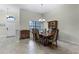 Bright dining room with natural light, a chandelier, and seating for six guests at 2829 Autumn Breeze Way, Kissimmee, FL 34744