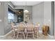 Inviting dining room featuring a neutral color scheme and a window overlooking the outdoors at 2829 Autumn Breeze Way, Kissimmee, FL 34744