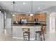 Beautiful kitchen with stainless steel appliances, granite countertops, and a center island with bar stool seating at 2829 Autumn Breeze Way, Kissimmee, FL 34744
