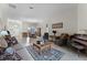 Spacious open-plan living room and dining area with tile flooring and lots of natural light at 2829 Autumn Breeze Way, Kissimmee, FL 34744