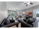 Cozy living room with comfortable seating, a large tv, and ample natural light at 2829 Autumn Breeze Way, Kissimmee, FL 34744