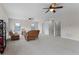 Large living room with three ceiling fans and many seating options at 2829 Autumn Breeze Way, Kissimmee, FL 34744