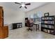Office showcasing a ceiling fan, window with blinds, and tile floors at 2829 Autumn Breeze Way, Kissimmee, FL 34744
