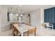 Inviting dining area with stylish pendant lighting, seamlessly connected to the kitchen at 3133 Emerald Acres Ln, Sanford, FL 32771