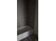 Modern bathroom featuring a soaking tub with sleek gray tiling at 3165 Cup Dr, Lakeland, FL 33803