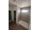 Modern bathroom featuring a walk-in shower with sleek gray tiling at 3165 Cup Dr, Lakeland, FL 33803
