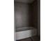 Modern bathroom featuring a soaking tub with sleek gray tiling at 3165 Cup Dr, Lakeland, FL 33803
