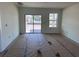 Spacious living room featuring a sliding glass door and large window, perfect for relaxing at 3165 Cup Dr, Lakeland, FL 33803