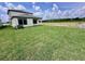 Spacious backyard with a manicured lawn offering plenty of room for outdoor activities at 3171 Cup Dr, Lakeland, FL 33803