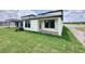 Exterior shot showcasing a well-maintained lawn and outdoor patio at 3171 Cup Dr, Lakeland, FL 33803