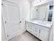 Bathroom featuring a double vanity with quartz countertops, drawers, and tile flooring at 3171 Cup Dr, Lakeland, FL 33803