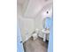 Powder bath featuring pedestal sink, large mirror, and neutral tile flooring at 3171 Cup Dr, Lakeland, FL 33803