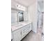 Bathroom featuring a double vanity with quartz countertops and modern fixtures at 3171 Cup Dr, Lakeland, FL 33803