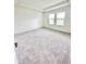 Spacious main bedroom with plush carpet, tray ceilings, and natural light at 3171 Cup Dr, Lakeland, FL 33803
